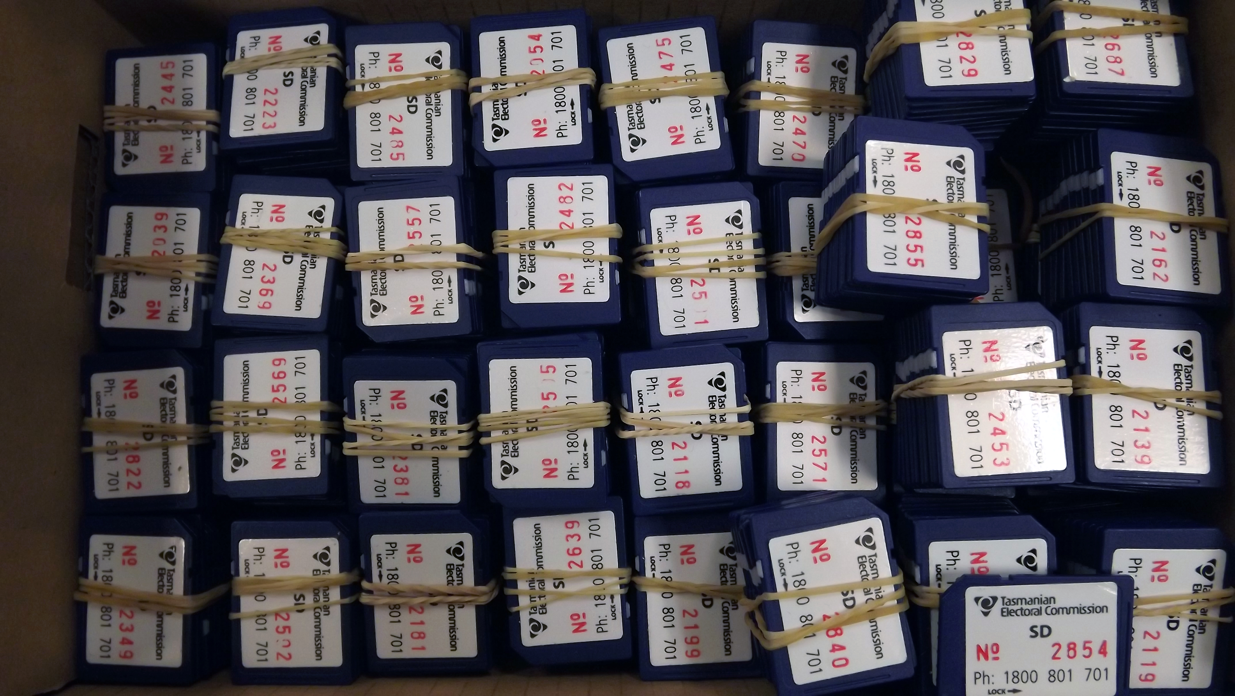 Bundles of SD memory cards that were used in Netbook computers to save rolls of voters