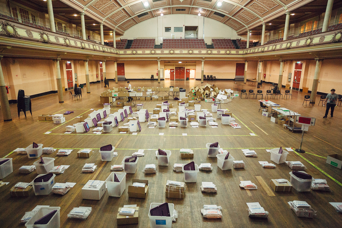 Packaged ballot papers and materials are sorted upon return to the Hobart Town Hall