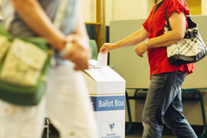 Person placing ballot paper in ballot box